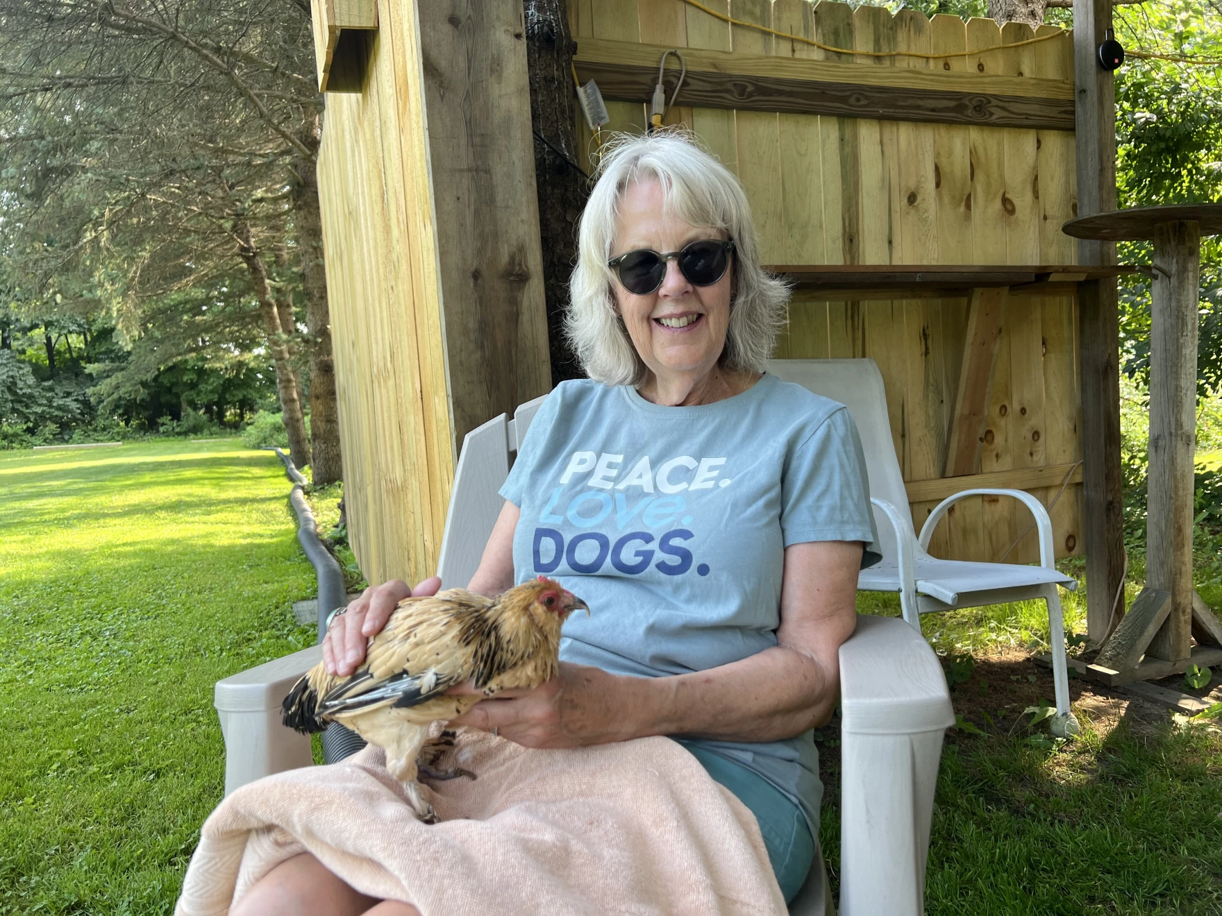 Marsi holding Peanut, the world's oldest chicken